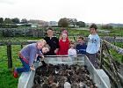 Olie, Marcus, Nick, Louise, Jessie, Scarlet and Reuben gathered around the trailier.