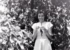 Margaret enjoying the grapes which were watered with the bath water via a trench