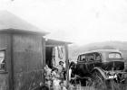 On Holiday -- Natal , Sunwich Port, early 30s  -- background is Mum and Betty -- foreground near spade is Boetie Erasmus; Verna and myself, Francina sitting in the car