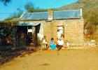 Oom Gillie with grandchildren revisiting some time after the farm hade been sold.